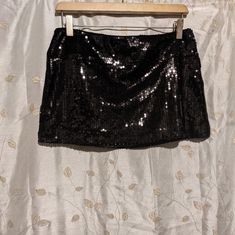 Size Small Little Black Mini Skirt Made With Black Sequence, Never Worn. It Has Matching Cropped Cardigan That's Selling Separately. But Can Also Be Sold Together Black Sequined Mini Skirt For Club, Lined Skort For Night Out, Glamorous Black Stretch Mini Skirt, Stretch Skort For Night Out, Black Party Skirt, Bling Skirt, Black Sequin Skirt, Black Skirts, Party Skirt