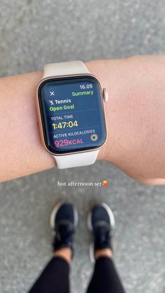 an apple watch on someone's arm showing the time and activity for their run