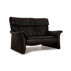 a black leather reclining chair on a white background, with the seat upholstered