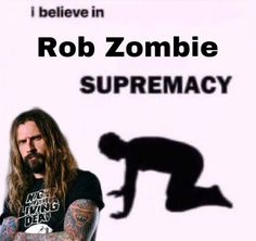 a man with long hair and tattoos standing in front of a white sign that says rob zombie