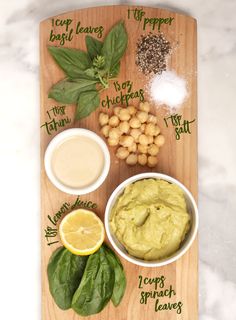 a wooden cutting board topped with different types of food and spices on top of it