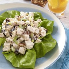 a plate with lettuce and chicken salad on it