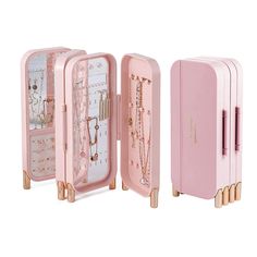 two pink jewelry cases with necklaces in them