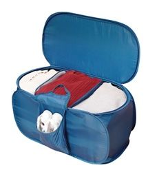 an open blue suitcase with clothes inside