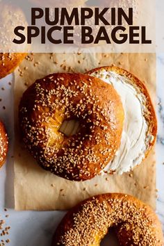 two bagels with cream cheese on top and the words pumpkin spice bagel above them