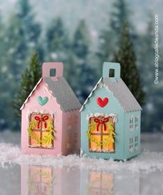 two small houses with christmas decorations on them