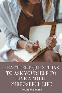 a woman writing in a notebook with the words, heart felt questions to ask yourself to live a more purposeful life