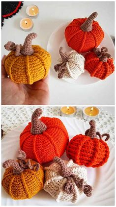 crocheted pumpkins are sitting on a white plate with candles in the background