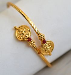 Gold tone Lakshmi coin pink stone bangle with size : 2.8 Festival Gold Bangle Bracelet, Festivals Gold Bangle Bracelet, Openable Bangle For Gift, Temple Jewelry Cuff Bracelet As A Gift, Adjustable Temple Jewelry Bangle, Adjustable Temple Jewelry Bangle Bracelets, Adjustable Temple Bangle Bracelet, Adjustable Bangle Bracelets In Temple Style, Festival Stackable Bangles