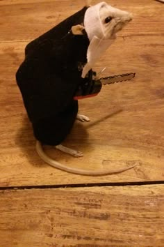 a toy mouse with a piece of cloth on its back