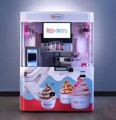 an ice cream machine with donuts in it