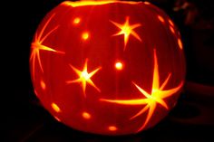 a carved pumpkin with stars on it