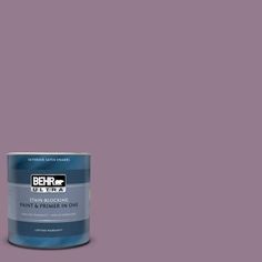 the behr ultra paint is shown in an open gray tin with purple and white accents