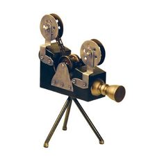 an old movie projector sitting on top of a tripod in front of a white background