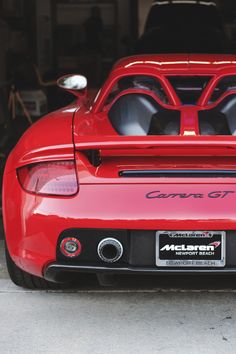 the back end of a red sports car