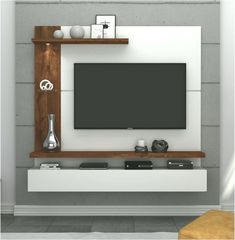 an entertainment center with a flat screen tv mounted on the wall