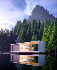 a floating house in the middle of a lake surrounded by trees and mountains with water reflecting it's surface