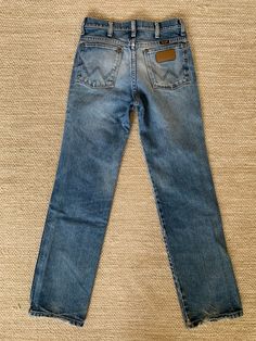 "Vintage 90's Wrangler Slim Fit Jeans size 28x32.  Style 936WD Part of our \"True Vintage Collection\" (Meaning 20yrs or older) Nicely broken in jeans with measurements laying flat: Waist 13.5\"  Front Rise 10\" Hip 17.5\" Thigh 9.5\" Length 39\" Knee 8\" Inseam 29.5\" Leg Opening 7.5\" Please see pics for more details. Button and zipper in the front 5 pockets Made in Mexico from USA material  100% Cotton For custom distress options please click link and add to your cart at check out:  https://w Hooded Denim Jacket, American Jeans, Recycled Jeans, American Denim, Sugar Cane, New Pant, Recycled Denim, Knit Sleeve, Wrangler Jeans