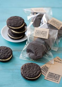 chocolate cookies are sitting on a plate next to each other and packaged in cellophane