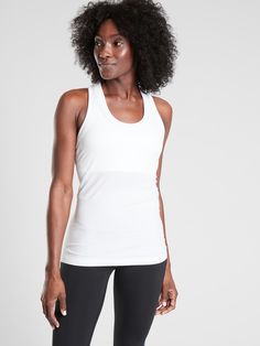 FOR: Medium to high impact workouts at the gym, studio or outdoors FEEL: Seamless construction for maximum comfort and minimal chafing FAVE: XT2® Anti-Odor Technology™: Eliminates odor without the chemicals, lasts as long as the garment Fitted, hip length Body length in size medium: 26" Workouts At The Gym, Compression Tank Top, Bday Wishlist, Gym Studio, Running Clothes Women, Workout Tops For Women, Relaxed Outfit, Sport Tank, Confident Woman