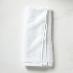 a white towel folded on top of a table