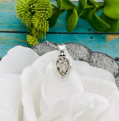 This beautiful and unique teardrop shaped sterling silver pendant comes on an 18" solid sterling silver chain. The center cremation "stone" is approximately 9x13mm. *All the pieces in my cremation collection have a finished look that resemble glass or stone once set. I do make these pieces with the ashes visible, however you can specify in a note to me if you would prefer not to see the ashes. I take great care in creating these special keepsakes and I can assure you that all cremains/ashes will Necklace With Ashes, Cremation Necklaces, Cremation Jewelry, Sterling Silver Chain, Pear Shape, Sterling Silver Pendant, Sterling Silver Chains, Pear Shaped, Sterling Silver Pendants