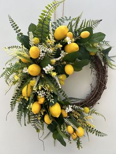 a wreath with lemons and white flowers