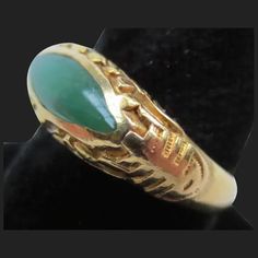 Offering for your consideration is this lovely vintage Chinese jadeite ring. Made of wonderful rich 22K gold. Interior is hallmarked 22K as well as the makers mark. Ring has been tested to ensure the metals purity. It is a size 6 1/4 and has a combined total weight of 4.8 grams. The sides have a Shou symbol which means longevity. Along the top is flowing vines and leaves. It proudly showcases a rich colored piece of Jadeite jade. It is natural A grade and free of any treatments. The eye shaped s Vintage Gold Emerald Cabochon Ring, Antique Gold Emerald Cabochon Ring, Heirloom Gold Jade Ring, Heirloom Jade Ring In Gold, Heirloom Gold Emerald Cabochon Ring, Formal Gold Jade Rings, Classic Gold Rings With Jade, Art Deco Gold Emerald Ring, Vintage Gold Emerald Ring For Collectors