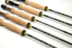 five different types of fishing rods lined up in a row