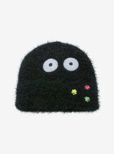 a black hat with eyes and flowers on it