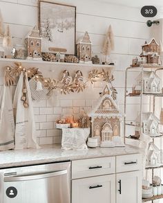 a kitchen with white cabinets and christmas decorations