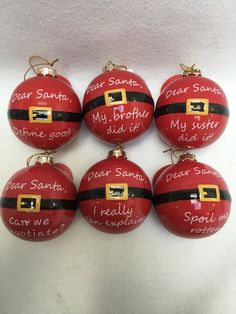 six red christmas ornaments with santa's names written on them and the words dear santa, my brother, my sister, and me