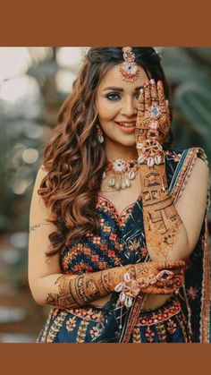 a woman with henna on her hands