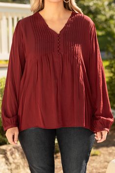 This top is the perfect combination of style and practicality! Featuring a gorgeous burgundy color and a comfortable fit, this top is perfect for the office or for a casual day out! Make a statement while staying comfortable with this beautiful piece! 65% Rayon 35% Polyester Relaxed Fit Solid Color Rayon Tops, Elegant Tops For Fall Casual Gatherings, Relaxed Fit Rayon Tops For Fall, Casual Burgundy Blouse For Work, Chic Burgundy Tops For Workwear, Casual Long Sleeve Burgundy Blouse, Casual Burgundy Blouse For Fall, Solid Tops For Casual Gatherings In Fall, Red Rayon Tops For Fall