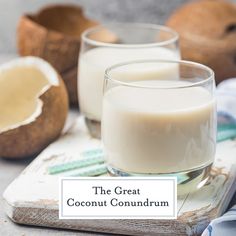 two glasses of coconut milk on a cutting board with the words, the great coconut conundrum