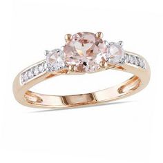 an oval morganite and diamond three stone ring