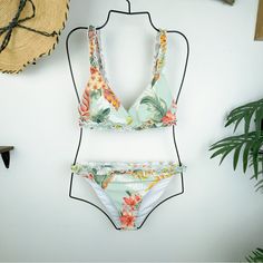 Lost And Wander Off To Makai Tropical Print Ruffle Bikini Set Swimwear Swimsuit 80% Nylon 20% Spandex Runs True To Size Hand Wash Or Wash With Gentle Cycle With Cold Water With Like Colors, Air Dry To Avoid Shrinkage. Tropical Lined Swimwear For Spring, Tropical Ruffled Tankini For Beach Season, Sleeveless Ruffled Swimwear For Vacation, Tropical Ruffle Swimwear For Beach Season, Tropical Ruffled Swimwear For Beach Season, Tropical Ruffled Tankini For The Beach, Tropical Ruffled Tankini For Poolside, Tropical One-piece Swimwear With Ruffles, Fitted Ruffle Swimwear For Vacation