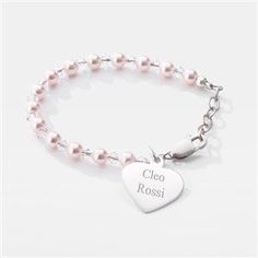 a bracelet with a heart charm on it and the word coco ross written in silver