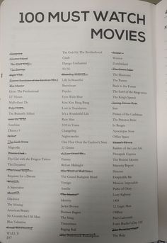 an open book with the words 100 must watch movies written in black and white on it