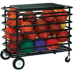 a basket full of basketballs sitting on top of a black cart filled with balls