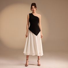 Elevate your wardrobe with our One Shoulder Crepe Midi Dress. The A line skirt design is not only eye-catching, but also flattering for any figure. Make a statement with this sophisticated and exclusive piece, perfect for a luxurious and tasteful occasion. Chic A-line Pleated Skirt, Chic A-line Cocktail Evening Dress, Chic A-line Maxi Dress For Semi-formal Occasions, Elegant A-line Mini Dress For Semi-formal Occasions, Dressy A-line Midi Dress For Evening, Elegant A-line Mini Dress For Semi-formal, Elegant A-line Pleated Skirt, Chic A-line Skirt For Party, Evening A-line Midi Dress For Night Out