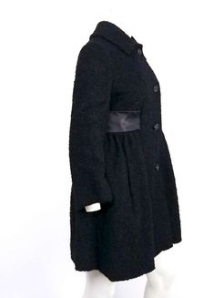 For Sale on 1stdibs - 1960s Black Boiled Wool Short Coat. Satin waist detail, gathered skirt of coat flares out in A-line silhouette. Decorative black buttons. Single-breasted Knee-length Outerwear For Evening, Evening Single-breasted Knee-length Outerwear, Evening Knee-length Single-breasted Outerwear, Evening Knee-length Single Breasted Outerwear, A-line Outerwear For Winter Party, A-line Winter Outerwear For Party, Knee-length Evening Outerwear For Winter, Winter Evening Knee-length Outerwear, Chic Evening Outerwear With Covered Buttons