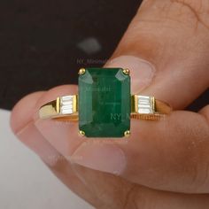 This ring is made with NY Minimalist Solid 14K Yellow Gold Genuine 4.50 Ct. Emerald-Cut Emerald Gemstone Baguette Diamond Engagement Ring Handmade Jewelry * SKU: SR01739 * Made to Order. * Gold Purity: 14K Solid Yellow Gold (stamped) * Custom Gold Color: Yellow, Rose, White Gold * Custom Gold Purity: 9K/14K/18K (Charges Apply) * Diamond 100% Genuine Diamond * Diamond Weight: 0.11 Ct. * Diamond Color: G-H * Diamond Clarity: SI1- SI2 * Diamond Cut: Marquise Cut * Emerald Weight: 4.5 Ct. Product Me Classic 14k Gold Emerald Ring With Baguette Diamonds, Classic Emerald Ring With Baguette Diamonds In 14k Gold, Emerald Ring In 14k Yellow Gold With Baguette Diamonds, Emerald Ring With Baguette Diamonds In 14k Yellow Gold, Emerald Rings With Baguette Diamonds, Emerald Wedding Rings, Emerald Ring Gold, Emerald Cut Engagement, Handmade Engagement Rings