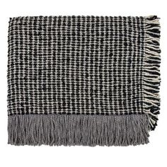 a black and white checkered blanket with fringes