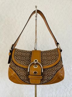 Vtg Coach Purse Shoulder Handbag soho bag 100% authentic , good vtg condition  Color: Brown Made of jacquard and genuine leather Silver tone Hardware Snap Belted buckle closure detachable shoulder strap Grossgrain fabric interior Very clean interior / exterior 10"L x 7"H x 2.5"D PLEASE INSPECT PICTURES WELCOME ANY QUESTIONS BEFORE CHEK OUT SORRY NO CANCELLATIONS / NO RETURNS Vintage Coach Bag, Handbag Essentials, Vintage Coach Bags, Shoulder Bag Brown, Coach Purse, Vintage Coach, Fashion Line, Leather Silver, Shoulder Handbag