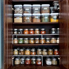 the shelves are filled with many different types of spices