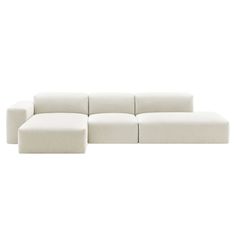 a white couch sitting on top of a white floor