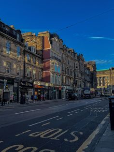 an empty city street with buildings on both sides