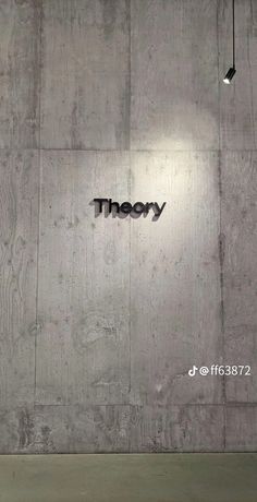 there is a sign that says theory on the wall