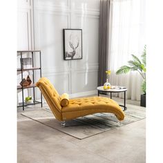 a yellow chaise lounger in a living room with white walls and flooring